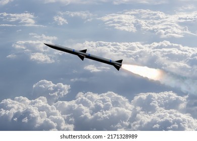 A combat rocket is flying above the clouds, smoke and fire from the rocket. Concept: missile attack, air attack, war between Russia and Ukraine, missile strike.