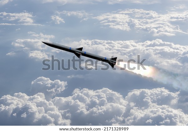 A combat rocket is flying above\
the clouds, smoke and fire from the rocket. Concept: missile\
attack, air attack, war between Russia and Ukraine, missile\
strike.
