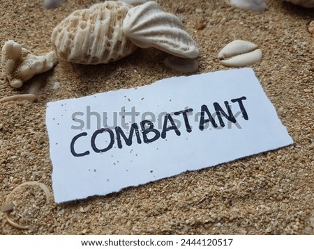 Combatant writting on beach sand background.