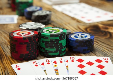 The Combination Of Card Game Poker On The Old Wooden Table