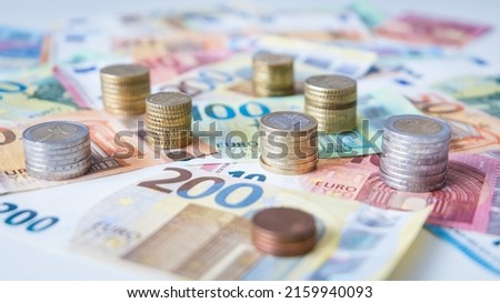 A combination of different Euro banknotes and Euro coins as a closeup