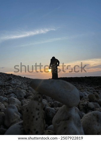combination of human rock and sunset