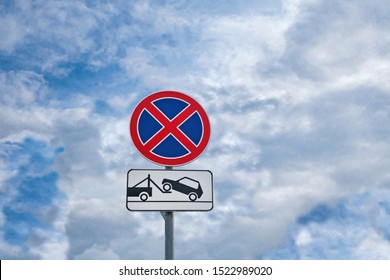 Combination of international traffic signs 'No parking' or 'No stopping' & 'Car evacuation' 