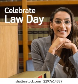 Combination of law day text over biracial female lawyer in library. Law day, barrister and law professional concept digitally generated image. - Powered by Shutterstock