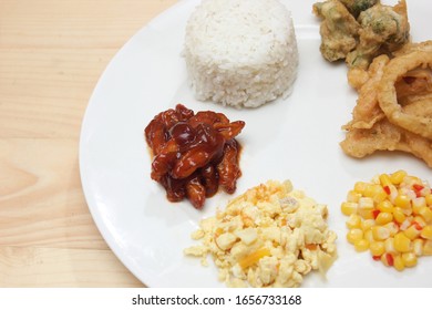 Combination Of Lunch. Corn, Meat, Onion Ring, Rice And Crispy Brocolli 