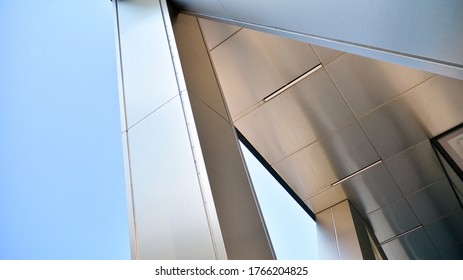 Combination of metal and glass wall material. Steel facade on columns. Abstract modern architecture. High-tech minimalist office building. Contemporary business architecture abstract fragment. - Powered by Shutterstock