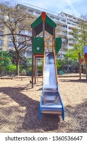 Combination Playground Structure For Small Children. Seesaw, Merry-go-round, Swingset, Slide, Jungle Gym, Chin-up Bars, Spring Rider, Trapez, Playhouse.