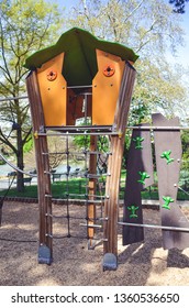 Combination Playground Structure For Small Children. Seesaw, Merry-go-round, Swingset, Slide, Jungle Gym, Chin-up Bars, Spring Rider, Trapez, Playhouse.