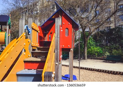 Combination Playground Structure For Small Children. Seesaw, Merry-go-round, Swingset, Slide, Jungle Gym, Chin-up Bars, Spring Rider, Trapez, Playhouse.