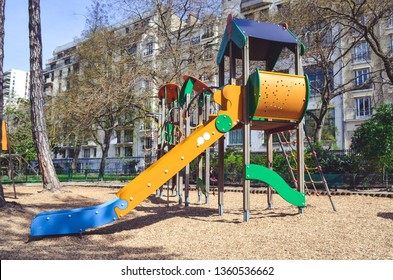 Combination Playground Structure For Small Children. Seesaw, Merry-go-round, Swingset, Slide, Jungle Gym, Chin-up Bars, Spring Rider, Trapez, Playhouse.