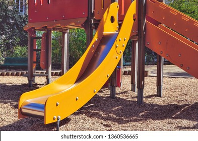 Combination Playground Structure For Small Children. Seesaw, Merry-go-round, Swingset, Slide, Jungle Gym, Chin-up Bars, Spring Rider, Trapez, Playhouse.