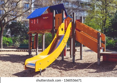 Combination Playground Structure For Small Children. Seesaw, Merry-go-round, Swingset, Slide, Jungle Gym, Chin-up Bars, Spring Rider, Trapez, Playhouse.