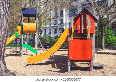 Combination Playground Structure For Small Children. Seesaw, Merry-go-round, Swingset, Slide, Jungle Gym, Chin-up Bars, Spring Rider, Trapez, Playhouse.