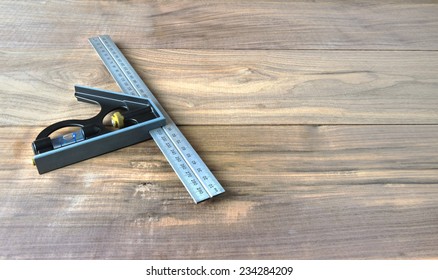 Combination Square on a walnut plank background