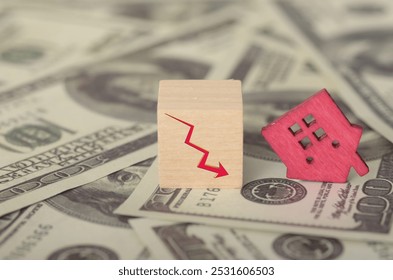 The combination of these elements suggests a potential decline in housing prices or the overall housing market.