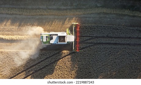 Combine Harvester Aerial View Looking Down Onto Dusty Field