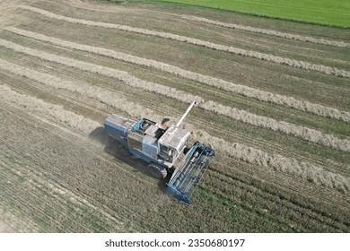 combine harvester Fortschritt E 512 aerial panorama of czech small agriculture farm during harvest time with old harvestor in the yeallow fields in Vysocina region,Czech republic,Europe
					