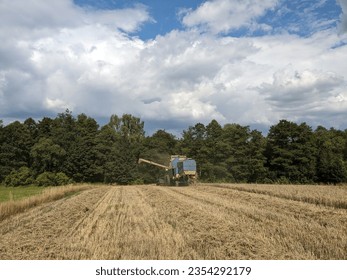 combine harvester Fortschritt E 512 panorama of czech small agriculture farm during harvest time with old harvestor in the yeallow fields in Vysocina region,Czech republic,Europe
					