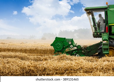 Combine Harvester Harvest Ripe Wheat On A Farm