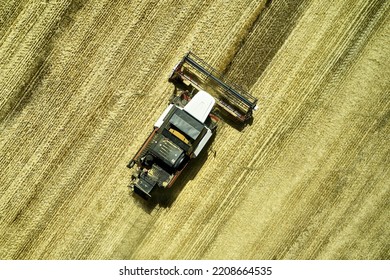 a combine harvester harvesting a field of wheat rural landscape. High quality photo