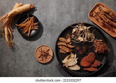 Combine Red Ginseng, Ginseng, Cordyceps, and finely chopped herbs to create a powerful health-promoting blend. - Shutterstock ID 2215332297