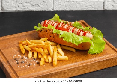 Combo classic hot dog with french fries on a wooden board. - Powered by Shutterstock