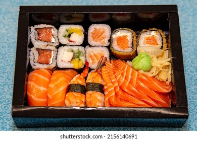 Combo of sushi and sashimi, oriental food, rice, salmon, shrimp, vegetables in the close-up box - Shutterstock ID 2156140691