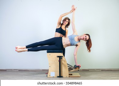 combo wunda pilates chair woman with instructor fitness yoga gym exercise. - Powered by Shutterstock