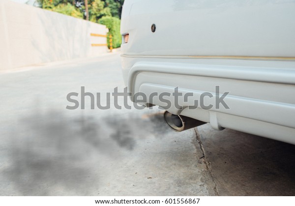 combustion fumes coming out, black smoke of sport\
car exhaust pipe