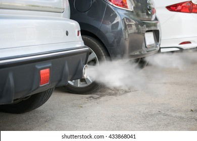 Combustion Fumes Coming Out Of Car Exhaust Pipe