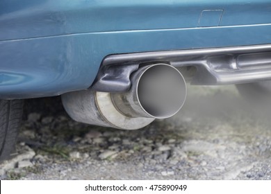 Combustion Fumes Coming Out Of Car Exhaust Pipe