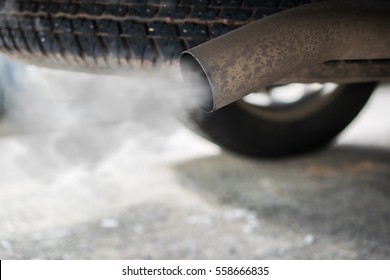 Combustion Fumes Coming Out Of Car Exhaust Pipe