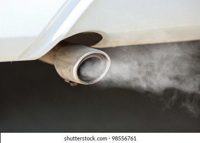 Combustion Fumes Coming Out Of Car Exhaust Pipe