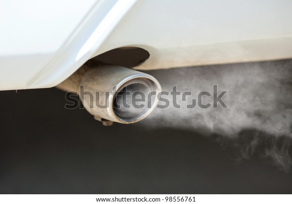 combustion fumes\
coming out of car exhaust\
pipe