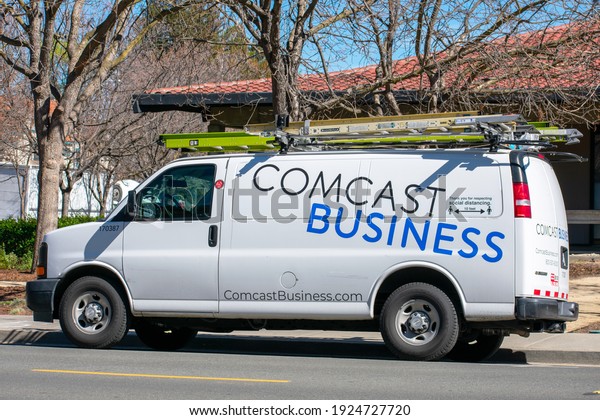 Comcast Business service van parked at customer\
location. Comcast Business, a subsidiary of Comcast, provides\
internet, phone, and cable television to businesses. - San Jose,\
California, USA - 2021