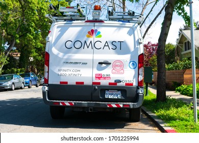 Comcast And Xfinity Telecommunications Service Van Parked On The Residential Street Near The Customer Home - Palo Alto, California, USA - 2020