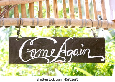 Come Again Phrase On Wooden Board