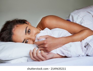 Come Back To Bed, Baby.... Portrait Of A Beautiful Young Woman Cuddling Blankets In Her Bed At Home.