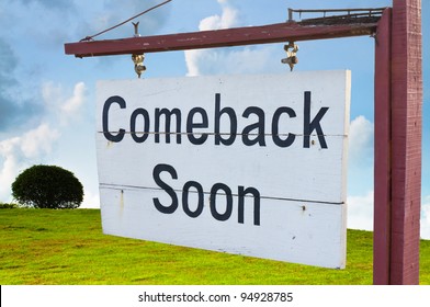 Come Back Soon Wood Sign With Green Hill And Blue Sky