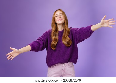 Come into my arms, girl wants give warm hug. Portrait of friendly and cute charming redhead woman stretching hands across copy space and looking forward with happy smile to cuddle and welcome guests