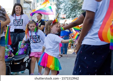 Come Out With Pride Parade Orlando Florida 10-13-18 USA Little Girl In Rainbow Skirt Hands Out Candy For College Park United Love Big