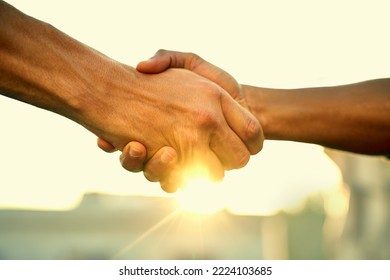 Come Together, Do Great Things. Cropped Shot Of Two People Shaking Hands Outdoors.