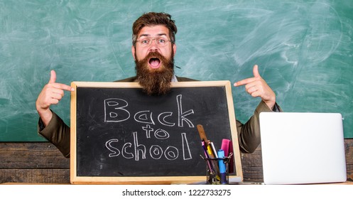 Come To Us. Teacher Welcomes New Pupils Enter Educational Institution. Teacher Or School Principal Welcomes With Blackboard Inscription Back To School. Private School Advertising To Boost Enrollments.