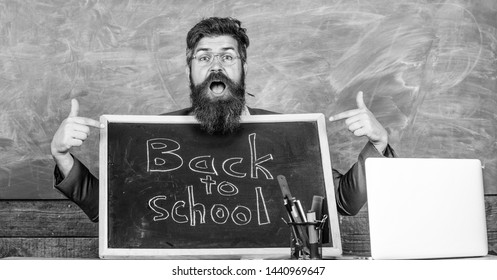 Come To Us. Teacher Welcomes New Pupils Enter Educational Institution. Teacher Or School Principal Welcomes With Blackboard Inscription Back To School. Private School Advertising To Boost Enrollments.