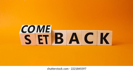 Comeback and setback symbol. Turned cubes with words setback and comeback. Beautiful orange background. Business concept. Copy space