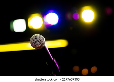 Comedy Club Show Microphone On Stage In Club With Blue Purple Yellow Stage Lighting Lights And Colors Music Concert Karaoke Hall Event