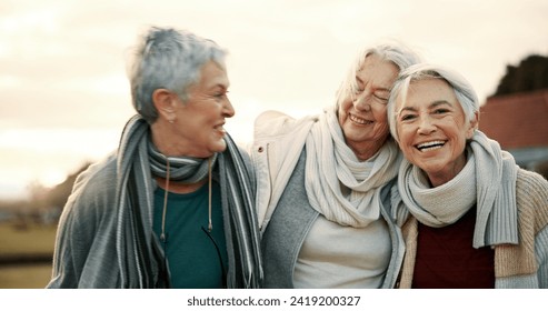 Comedy, laughing and senior woman friends outdoor in a park together for bonding during retirement. Portrait, smile and funny with a happy group of elderly people bonding in a garden for humor or fun - Powered by Shutterstock