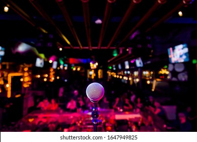 Comedy Microphone on Stage of Comedy Music Show in Club with Lights and Colors