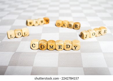 Comedy word on wood block - Shutterstock ID 2242784157