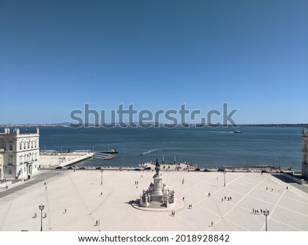 The Comercio Praca square on the coast under clear blue sky in Lisbon, Portugal